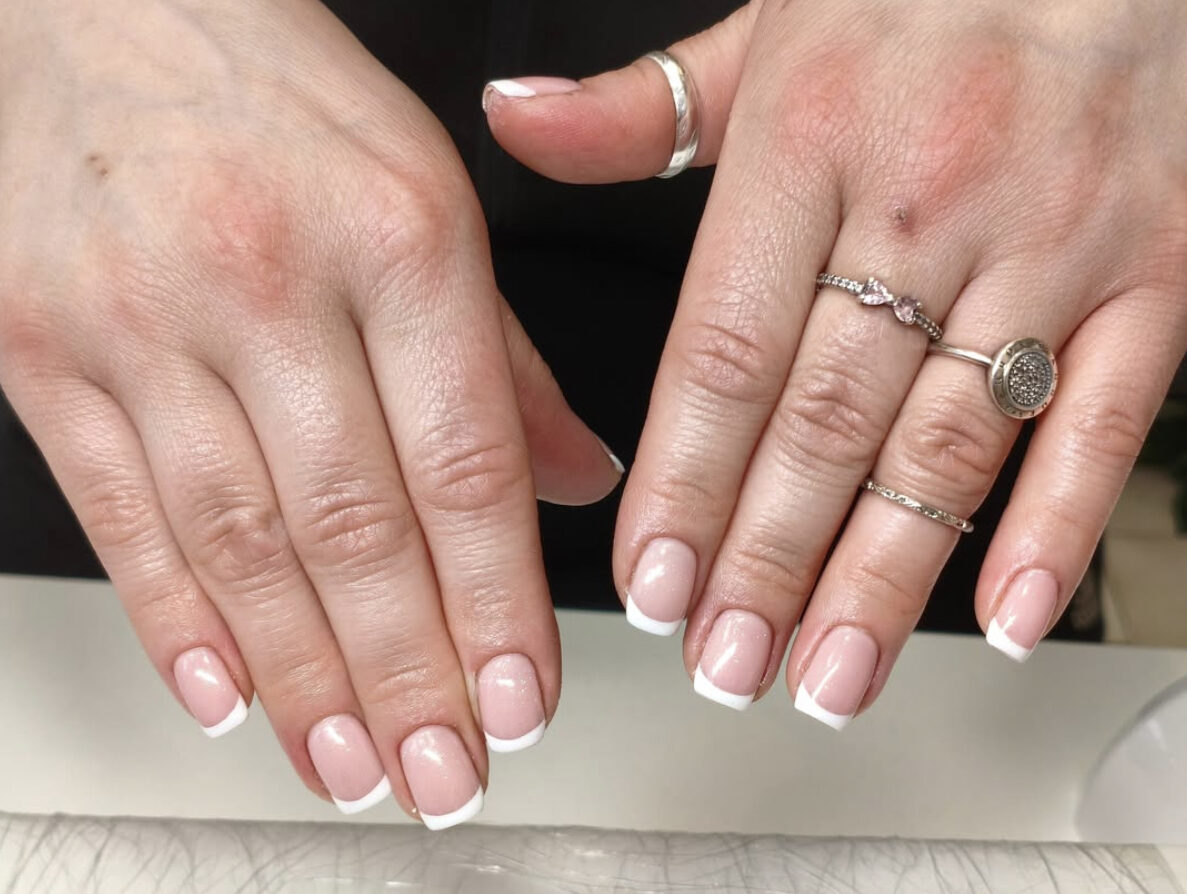 Classic white-tip French manicure on short square nails
