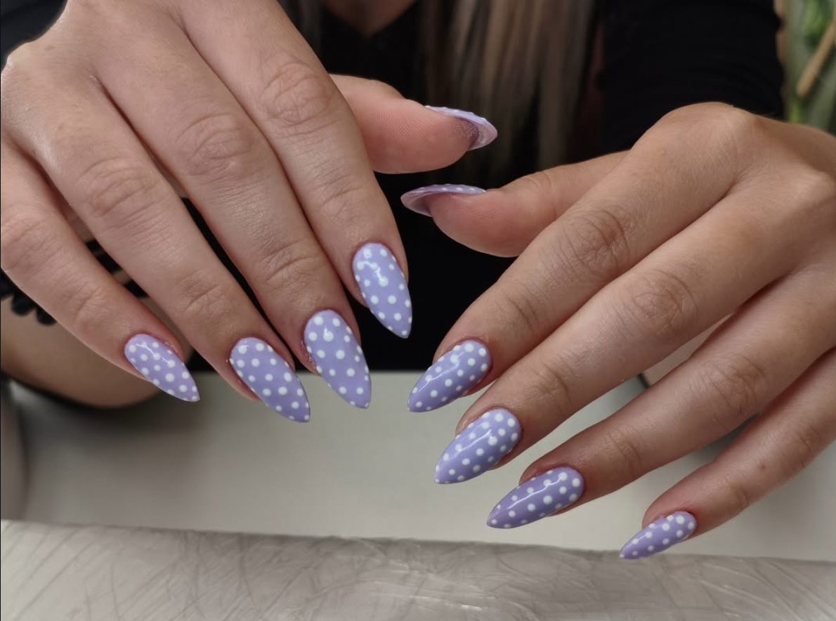 Pastel lilac almond manicure with white polka dot nail art