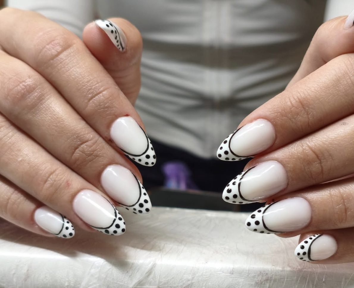 Black and white dotted French tip almond manicure