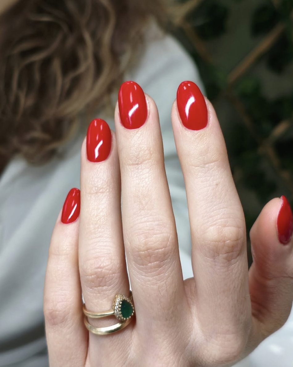 Glossy classic red almond gel manicure