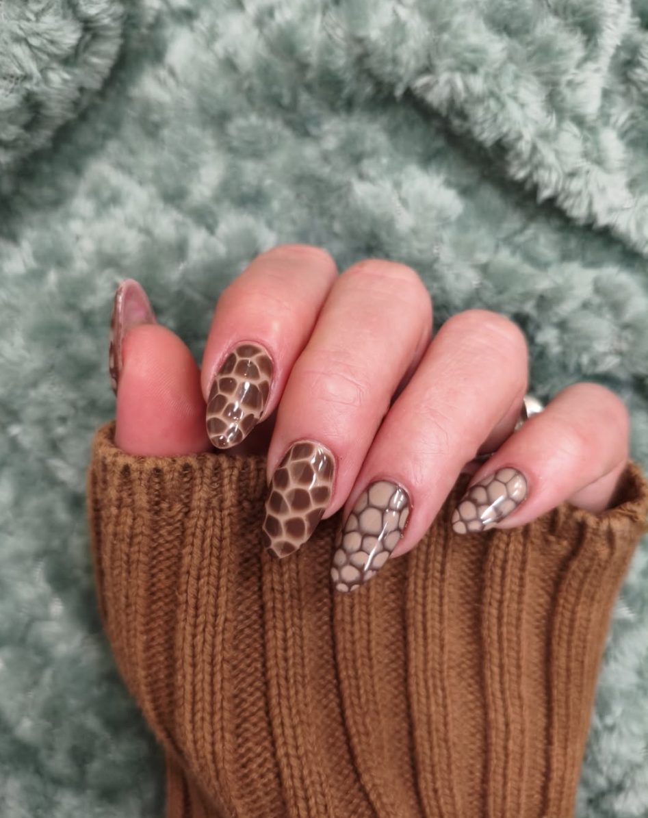 Brown 3D blooming gel snake skin nail art on almond nails